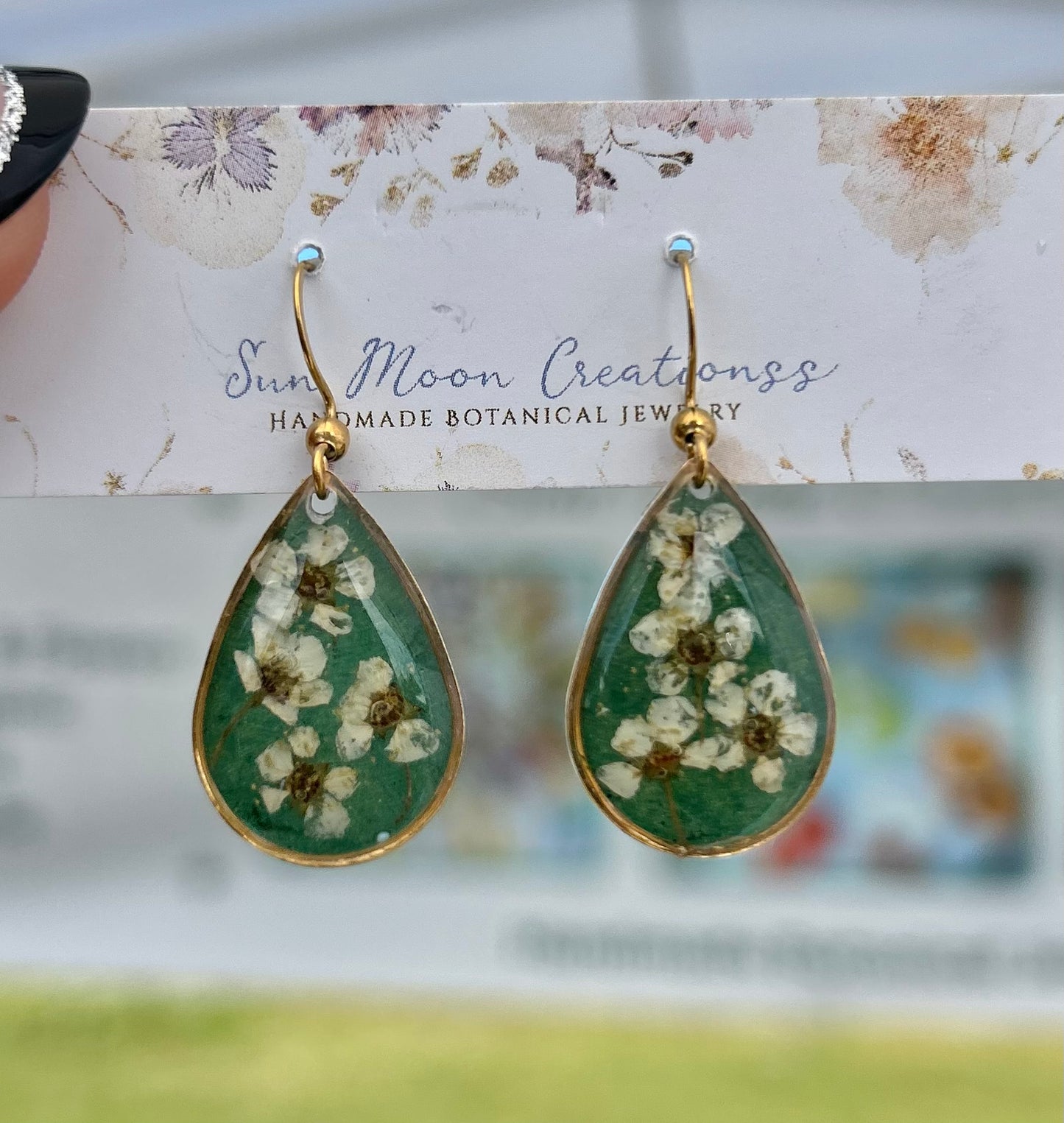 Dark Green and Teardrop dangles with forget me not flowers in gold