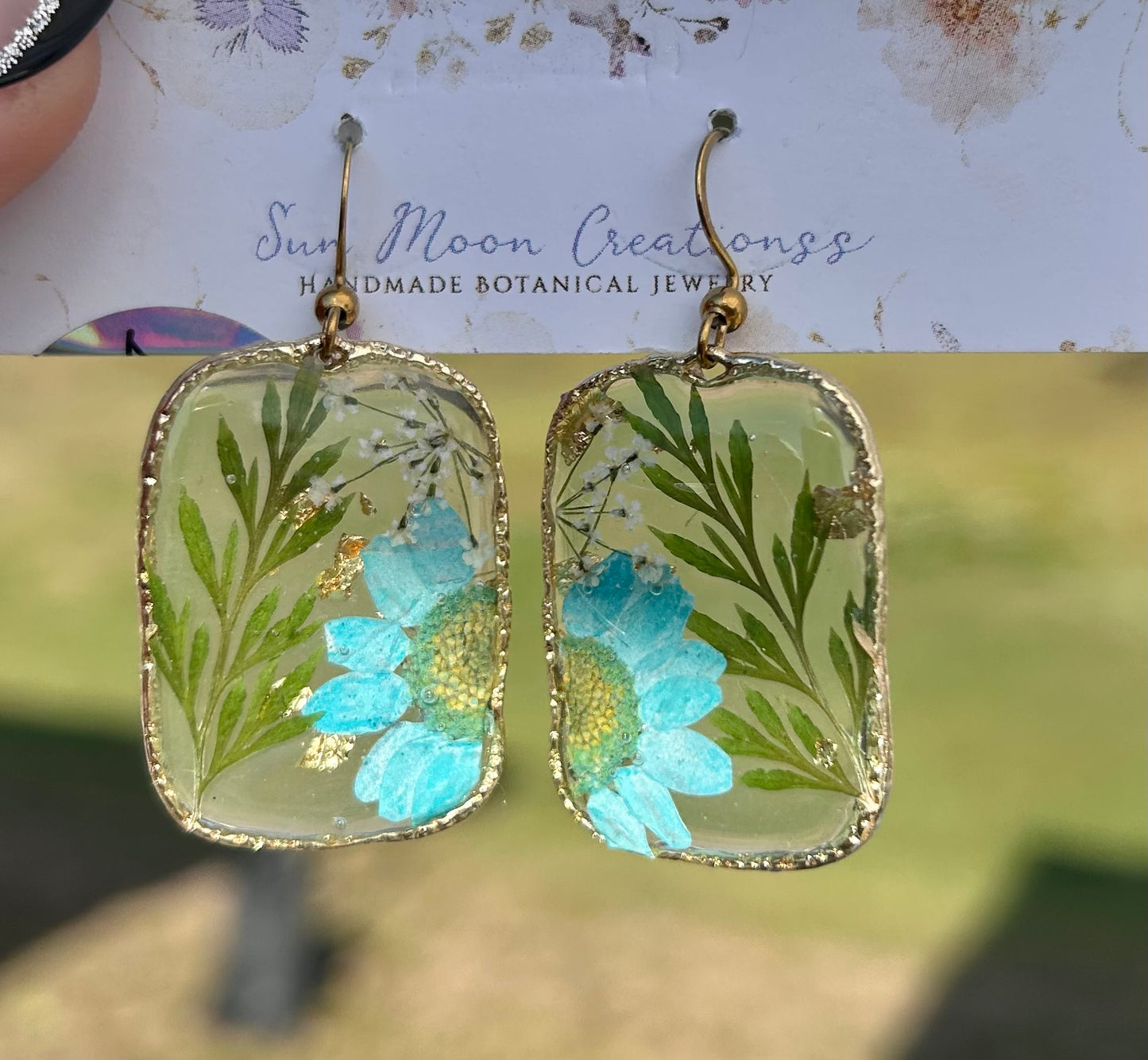 Sky blue flowers with fern dangles organic square