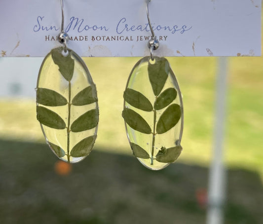 Oval and fern dangles in medium,silver